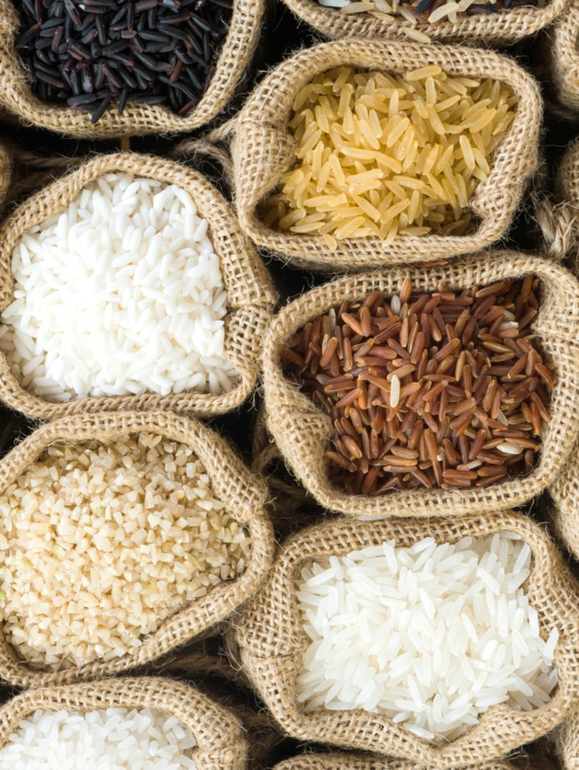 Top view Thai's rice collection in burlap bag